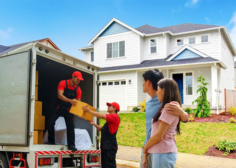 A couple watching Moscardelli Moving & Storage movers unload cardboard boxes from a truck in front of a two-story suburban home in Springfield, IL
